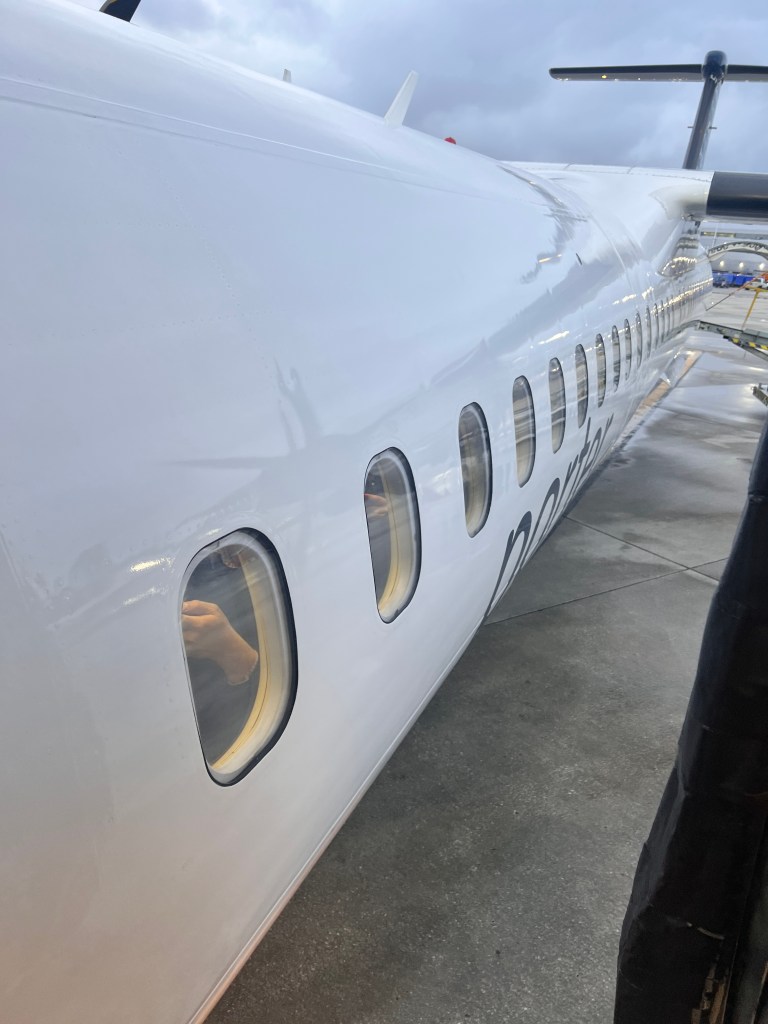 Dash 8 fuselage in Porter livery.