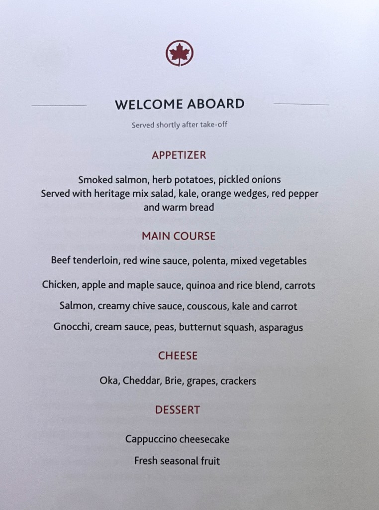 The menu distributed onboard shortly after boarding, featuring an appetizer, choice of main course, cheese, and desert.